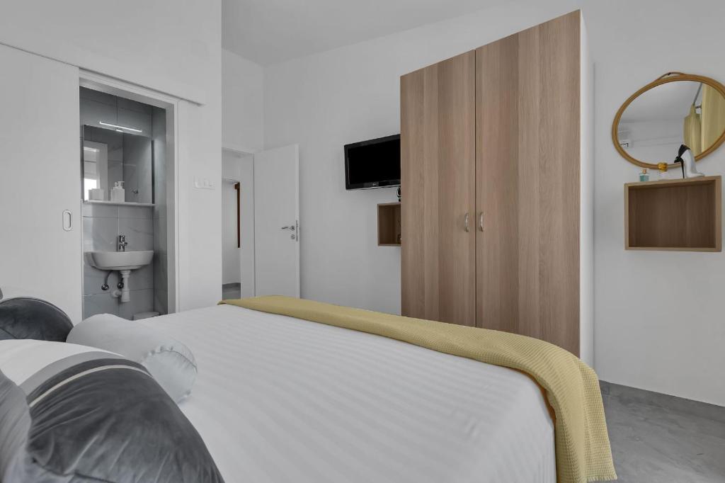 Posteľ alebo postele v izbe v ubytovaní Ana Apartment