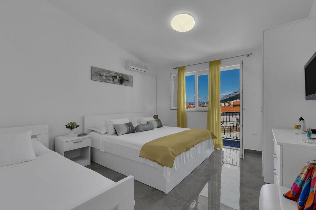 Posteľ alebo postele v izbe v ubytovaní Ana Apartment