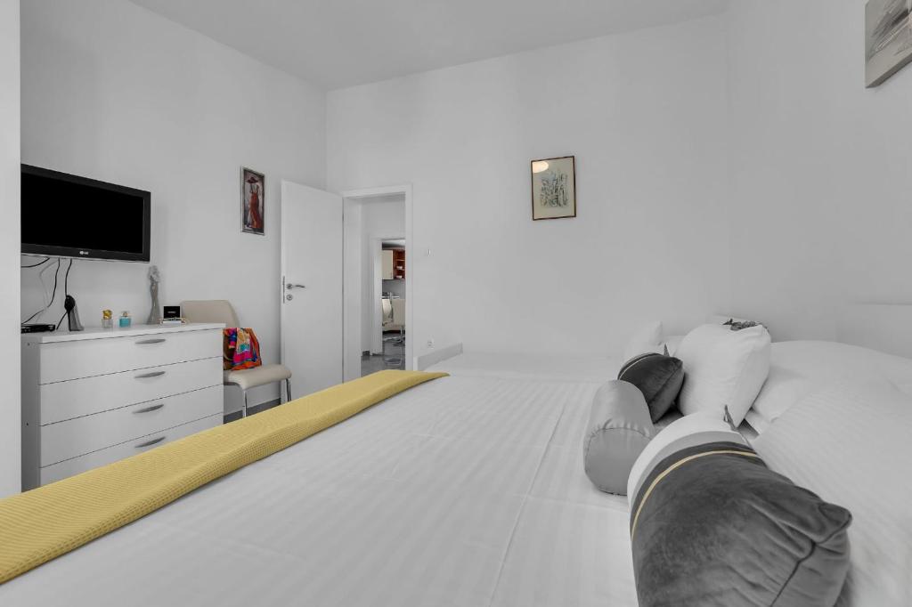 Posteľ alebo postele v izbe v ubytovaní Ana Apartment