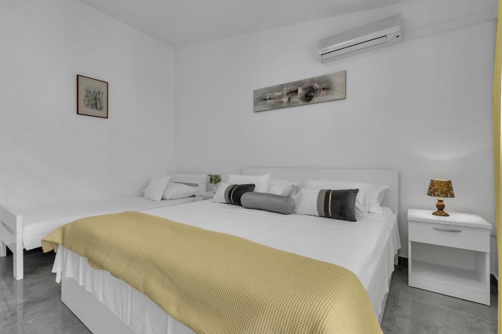 Posteľ alebo postele v izbe v ubytovaní Ana Apartment