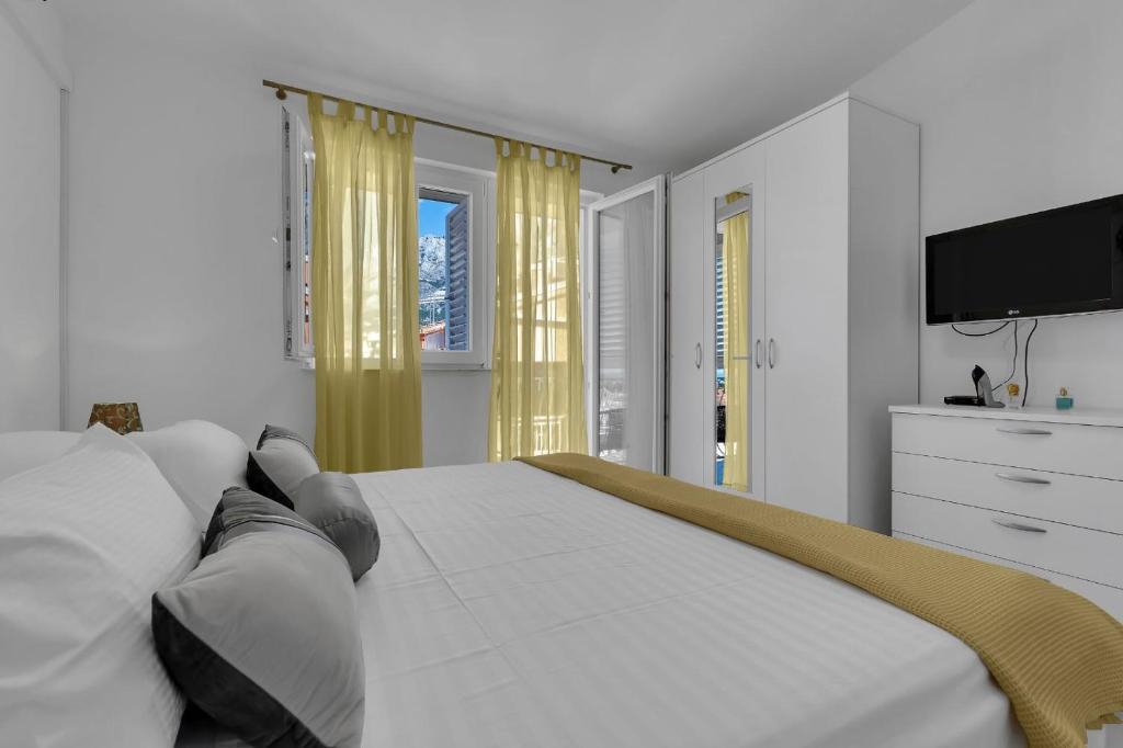 Posteľ alebo postele v izbe v ubytovaní Ana Apartment