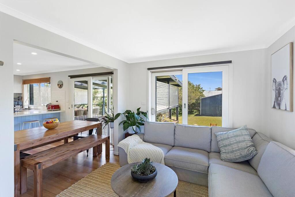 a living room with a couch and a table at Kookaburra Hideaway 4-Bed 2-Bath in Cowes