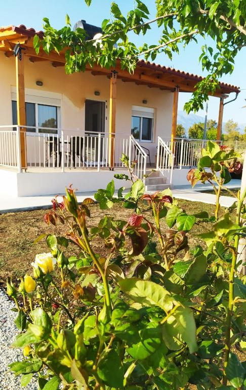 a house with a garden in front of it at Ilios - country house in Kalamaki
