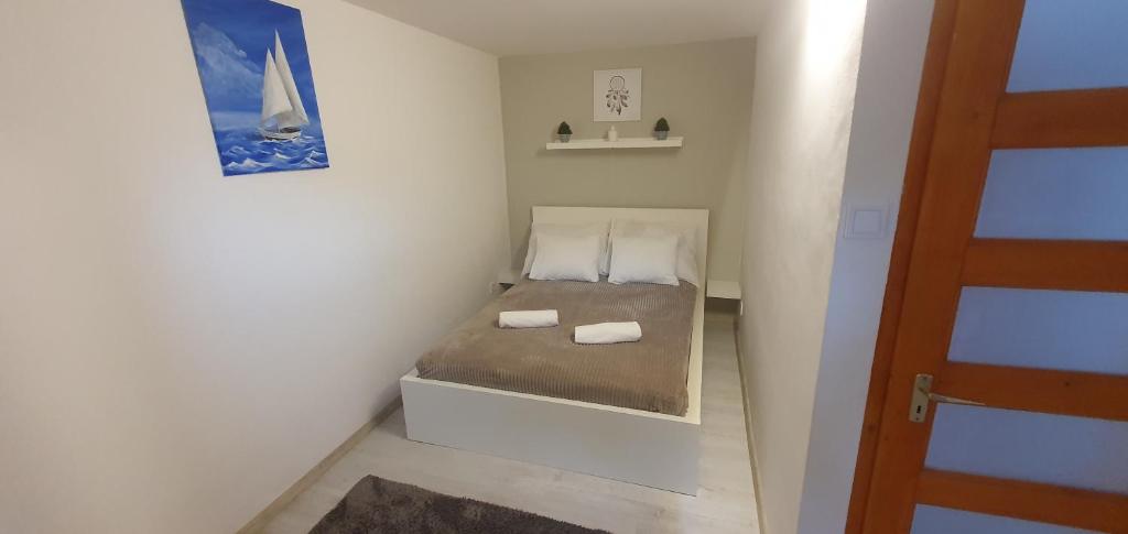 Postel nebo postele na pokoji v ubytování Panoráma Csopak