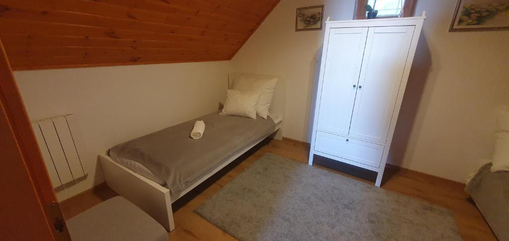 Postel nebo postele na pokoji v ubytování Panoráma Csopak