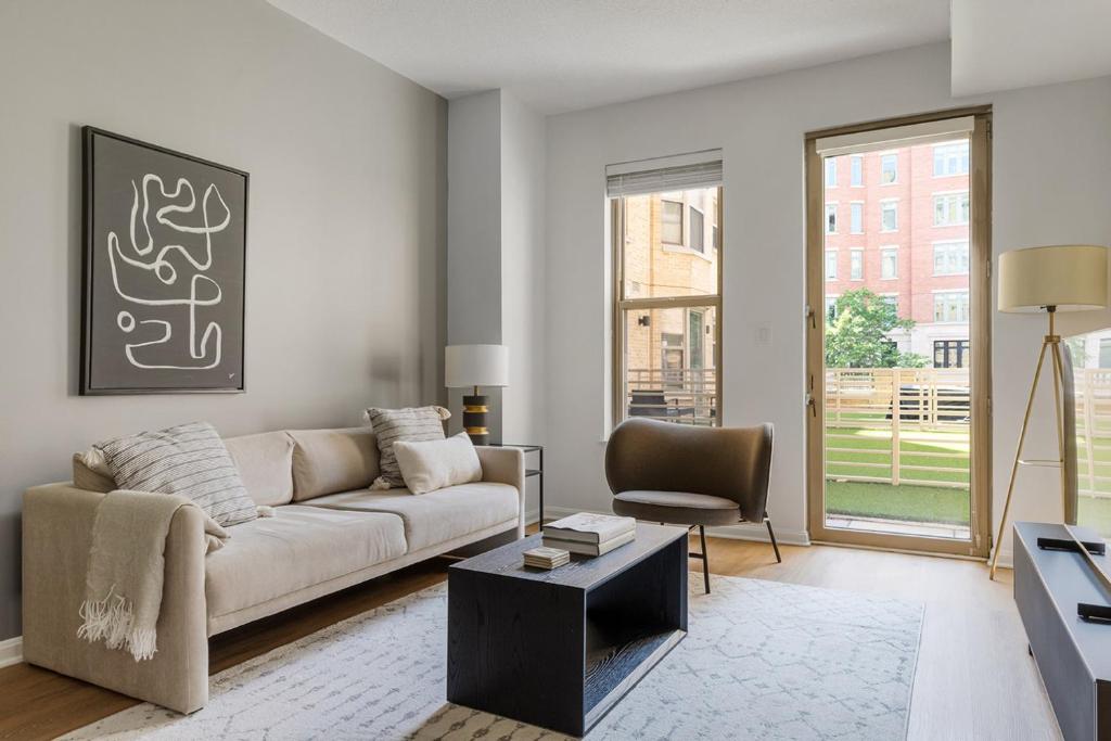 a living room with a couch and a chair at U Street 1br w gym wd nr metro dining WDC-676 in Washington