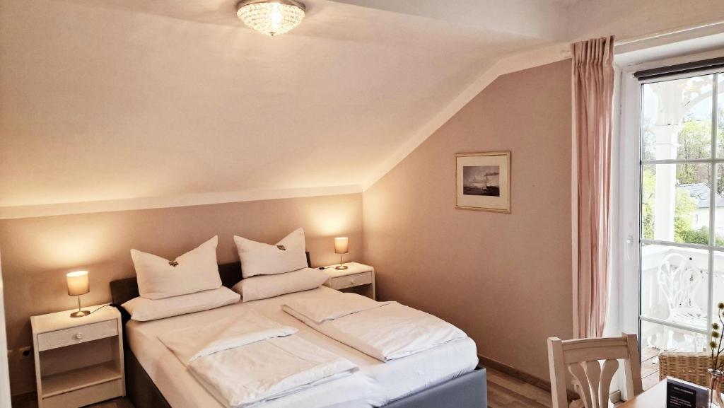 Postel nebo postele na pokoji v ubytování Hotel Villa Sisi