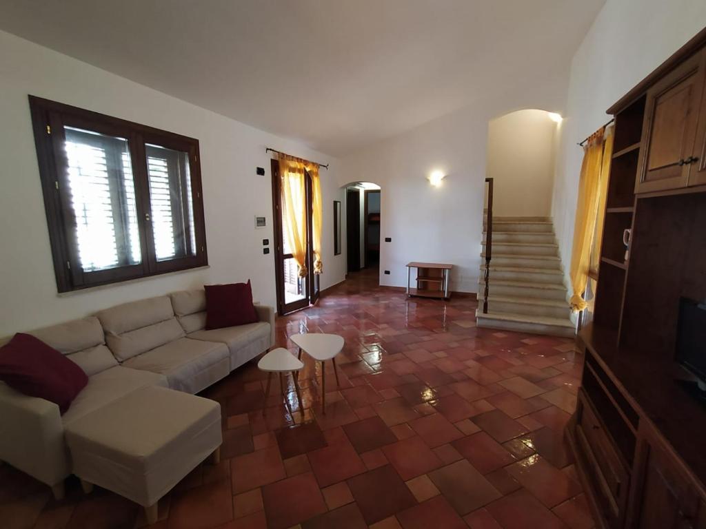 a living room with a couch and a table at SanVitoTour- Residence Il Baglio in San Vito lo Capo