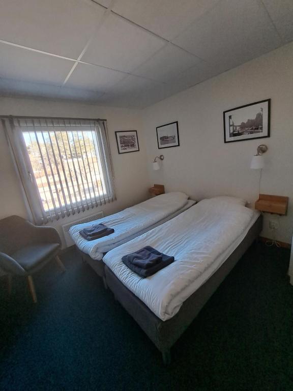 Postel nebo postele na pokoji v ubytování Kramfors Stadshotell AB