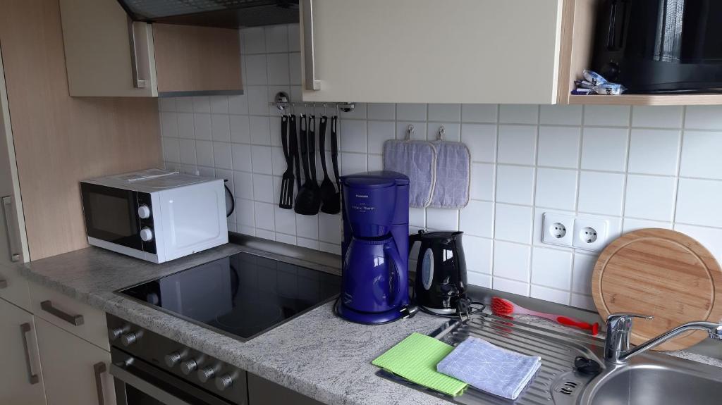 Kuchyň nebo kuchyňský kout v ubytování Ferienwohnung-Zweiburgenblick