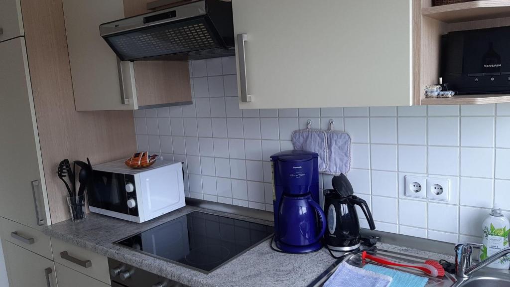 Kuchyň nebo kuchyňský kout v ubytování Ferienwohnung-Zweiburgenblick