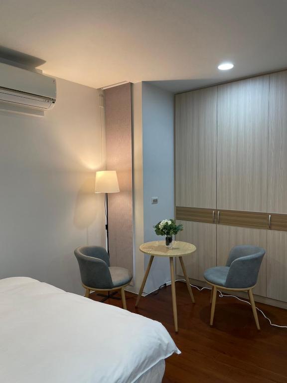 Postel nebo postele na pokoji v ubytování Luodong warm house