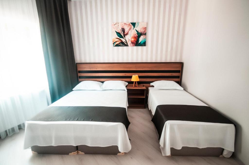 Postel nebo postele na pokoji v ubytování MiLAROOM