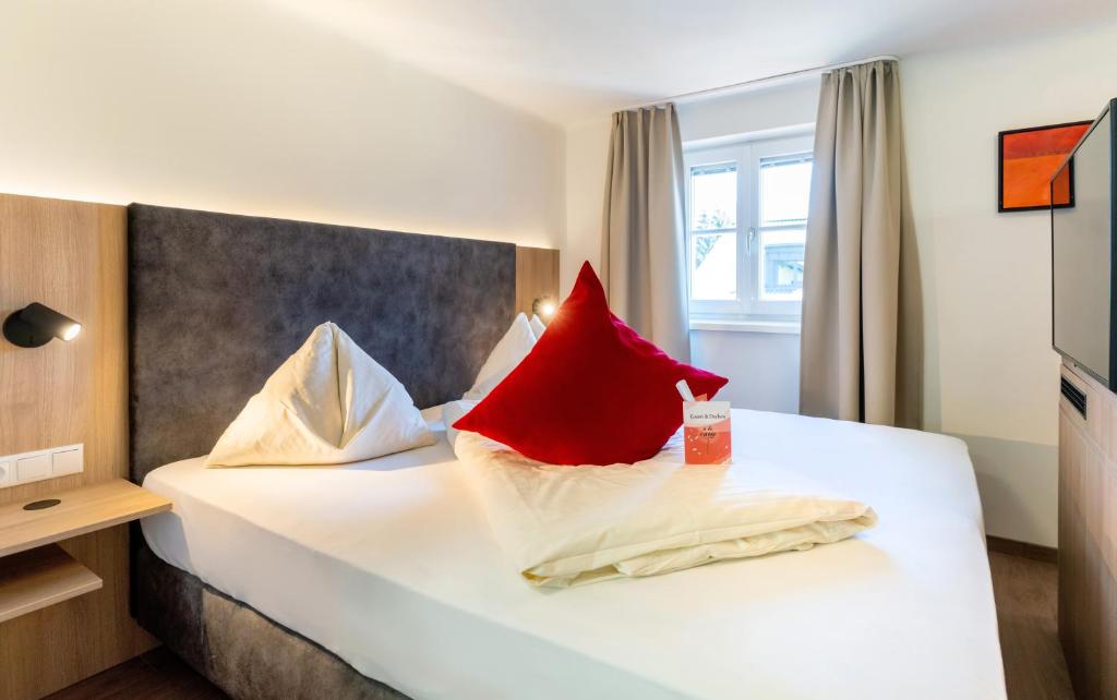 Postel nebo postele na pokoji v ubytování Hotel Rosenvilla