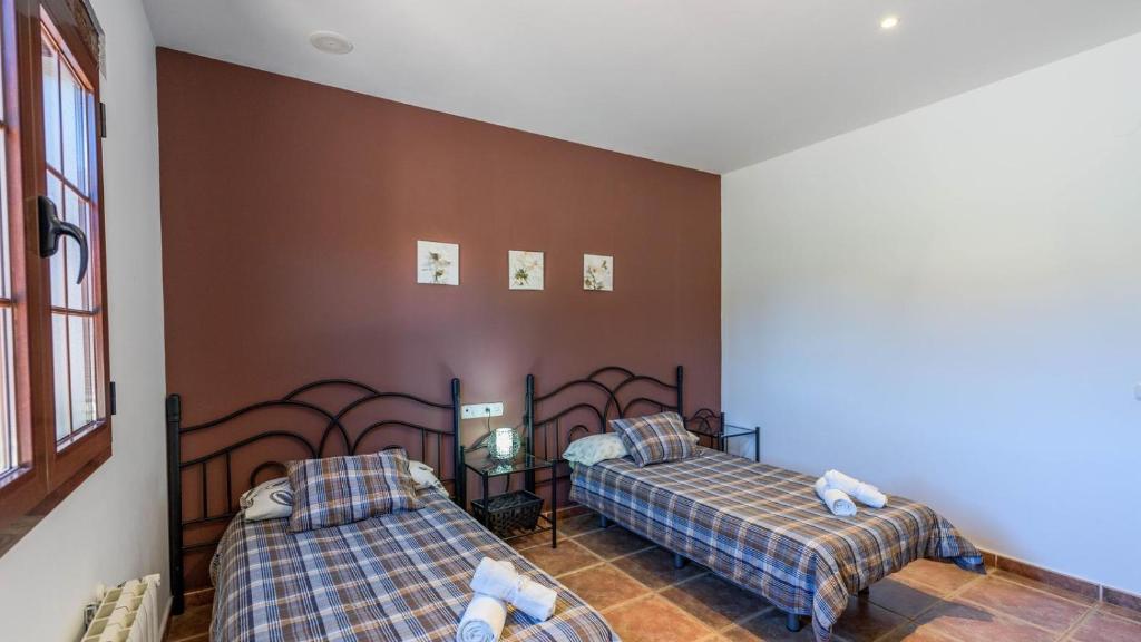 Posteľ alebo postele v izbe v ubytovaní Villa Mariana Ronda by Ruralidays