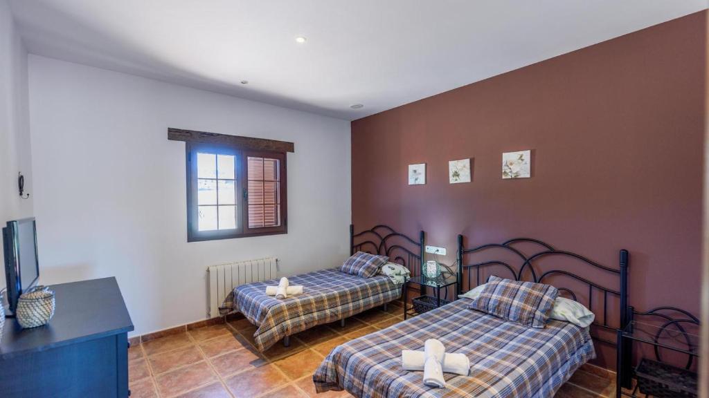 Posteľ alebo postele v izbe v ubytovaní Villa Mariana Ronda by Ruralidays