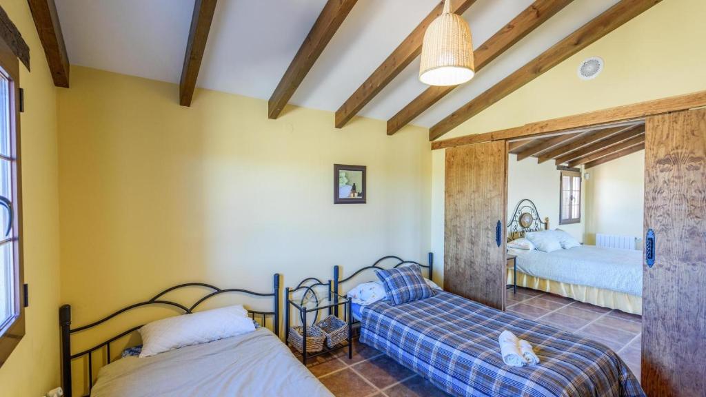 Posteľ alebo postele v izbe v ubytovaní Villa Mariana Ronda by Ruralidays