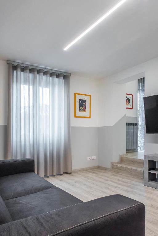 TV a/nebo společenská místnost v ubytování PETIT casa vacanze