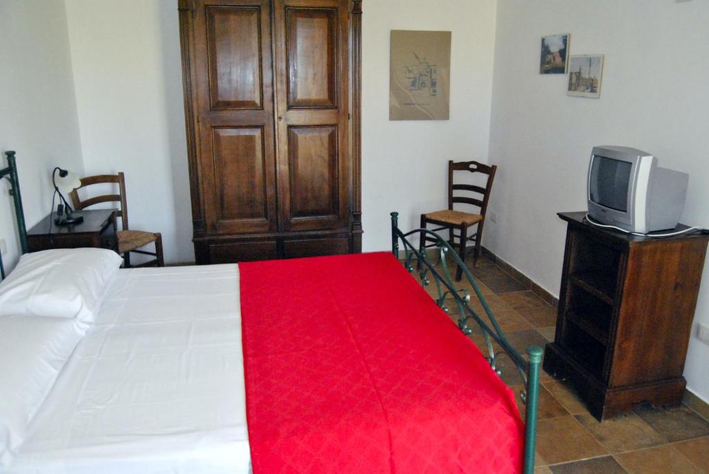 Postel nebo postele na pokoji v ubytování Agriturismo La Lucia