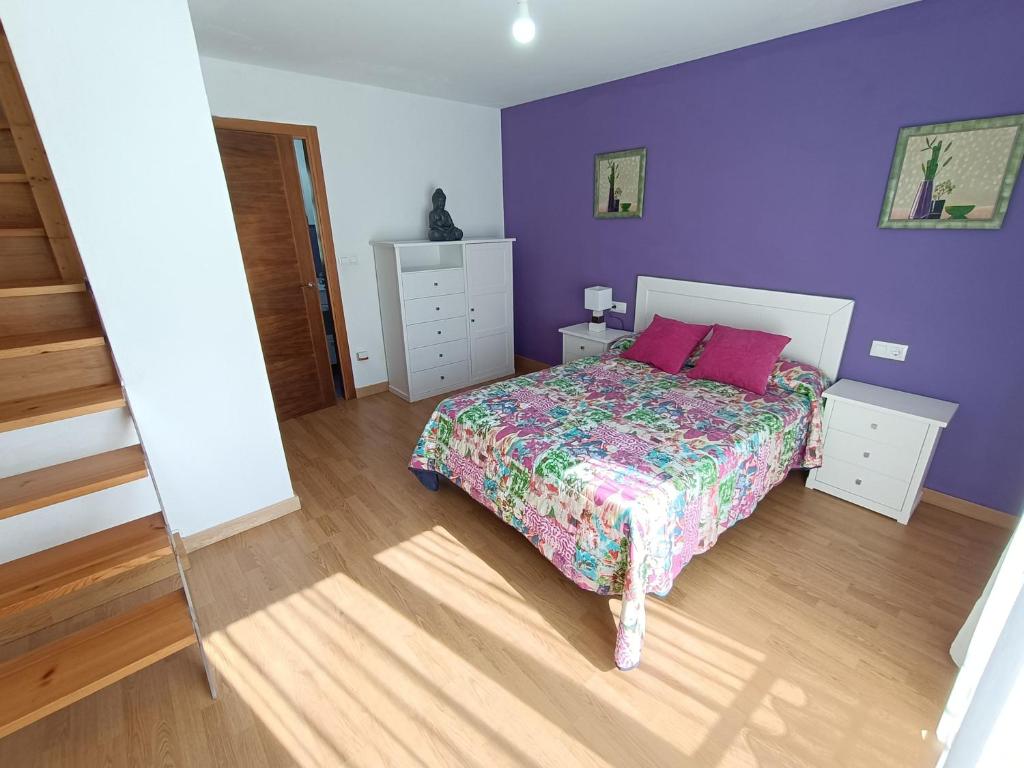 Postel nebo postele na pokoji v ubytování Casa Antiuxía