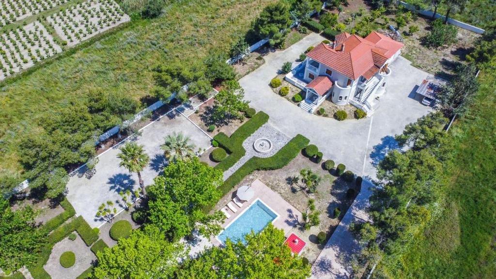 an overhead view of a house with a swimming pool at Adriana di Levante in Ayios Kirikos