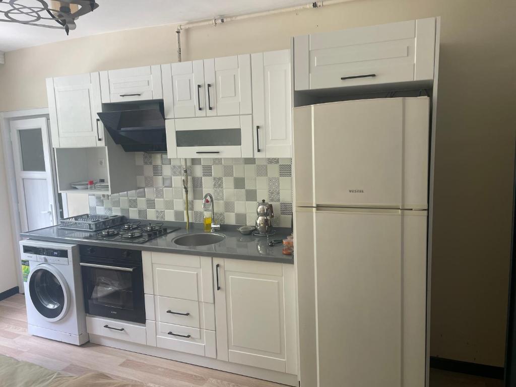 Kuchyň nebo kuchyňský kout v ubytování Eyüpsultan ABS Suites