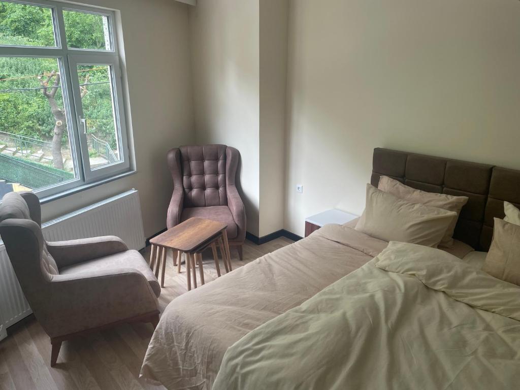 Postel nebo postele na pokoji v ubytování Eyüpsultan ABS Suites