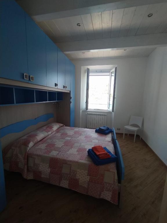 Posteľ alebo postele v izbe v ubytovaní Casa della Nonna casevacanzeargentario