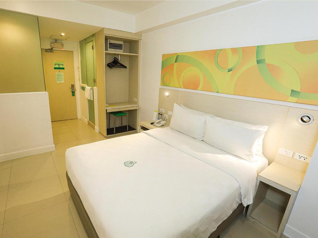 Postel nebo postele na pokoji v ubytování Go Hotels Ermita, Manila