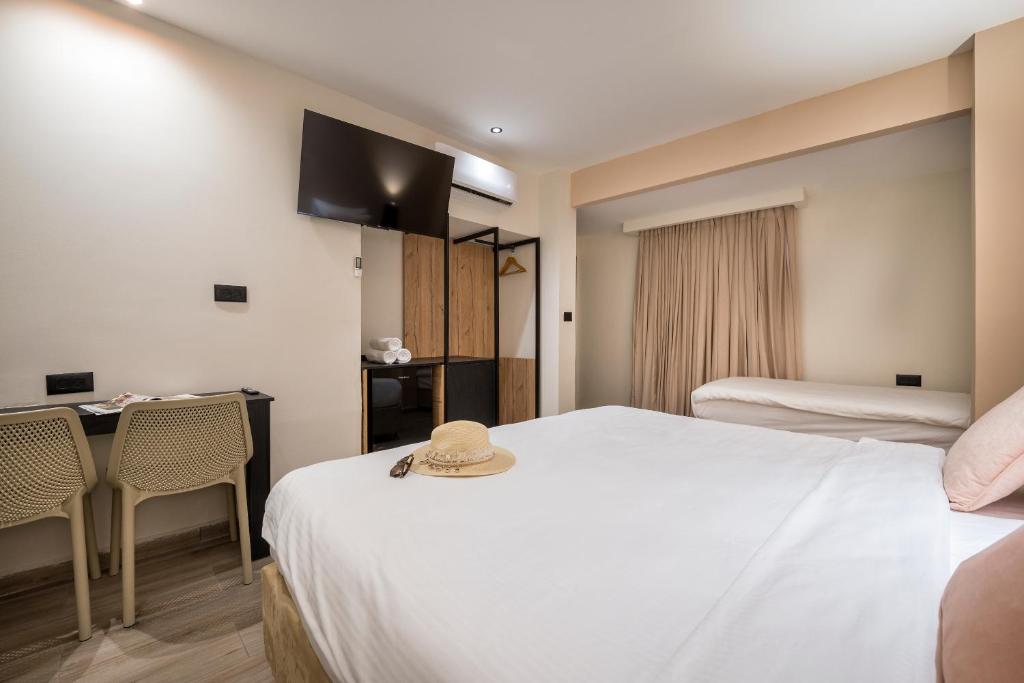 Кровать или кровати в номере Sahara Hotel Eilat
