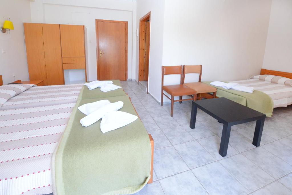 Łóżko lub łóżka w pokoju w obiekcie Veroniki Hotel