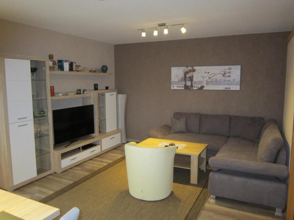 a living room with a couch and a table at Ferienwohnung Sonja Sinsheim in Sinsheim