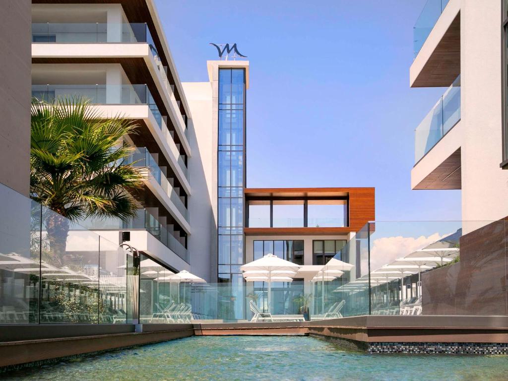 a rendering of a building with a swimming pool at Mercure Larnaca Beach Resort in Larnaka