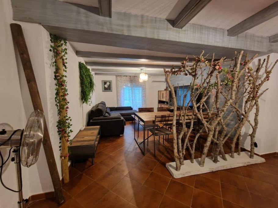 a living room with a table and a couch at Apartamento cerca de la playa in Chiclana de la Frontera