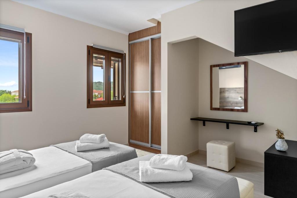 Postel nebo postele na pokoji v ubytování The Dandy Villas Sivota