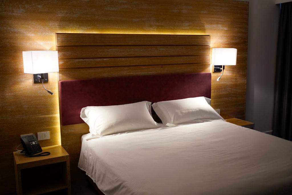Posteľ alebo postele v izbe v ubytovaní PM Hotel