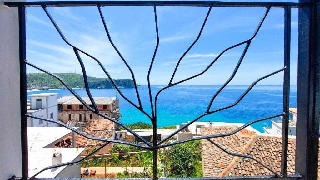 a view of the ocean from a window at Beleri House in Himare