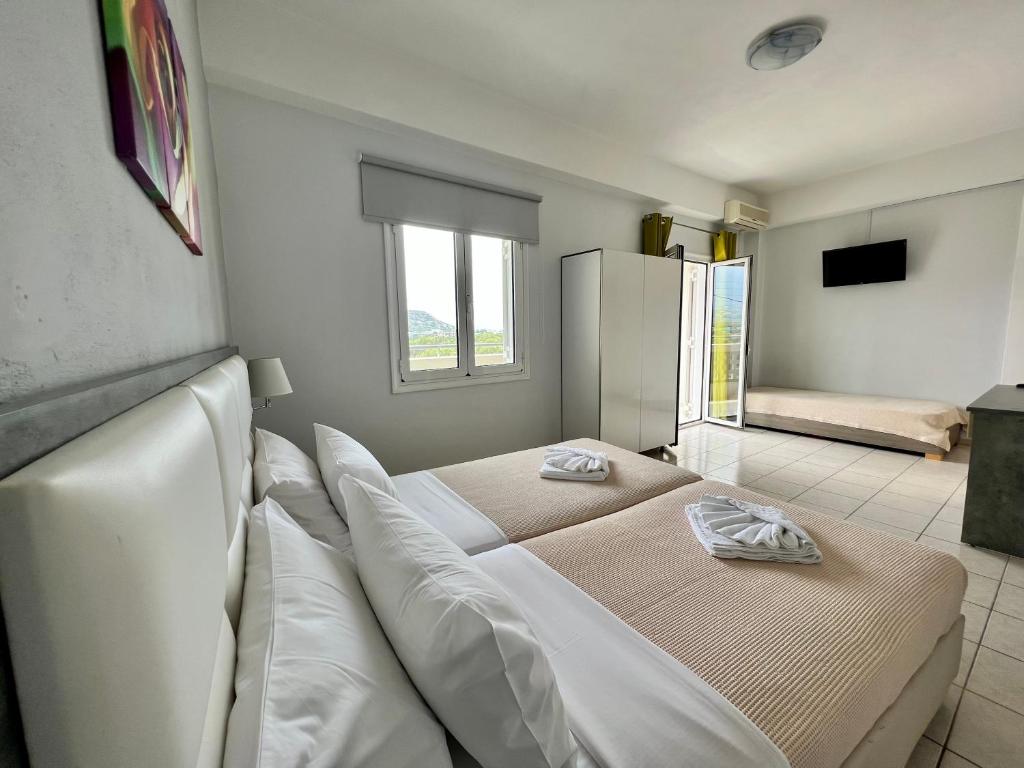 Postel nebo postele na pokoji v ubytování Maria Hotel Sisi