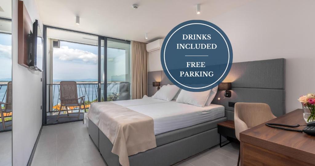 a hotel room with a bed and a free parking sign at Paviljoni Omorika in Crikvenica