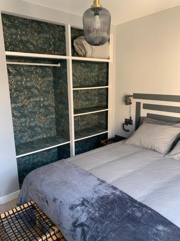 Postel nebo postele na pokoji v ubytování NOARU Apartamentos