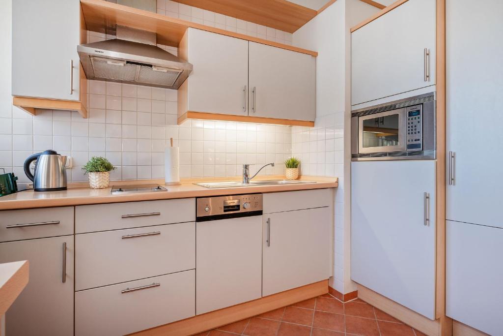 Kuchyň nebo kuchyňský kout v ubytování Villa Vineta Wohnung 203