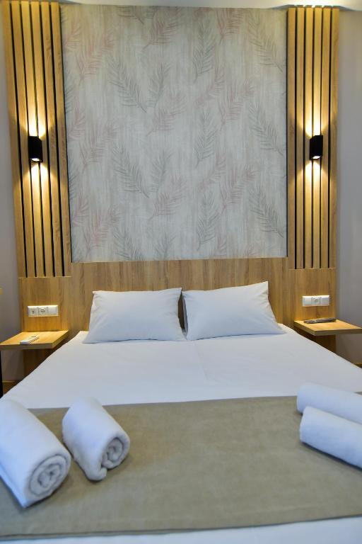 Postel nebo postele na pokoji v ubytování Euro Hotel Kutaisi