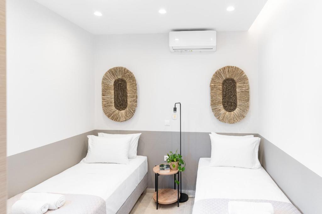 Letto o letti in una camera di Syra Suites