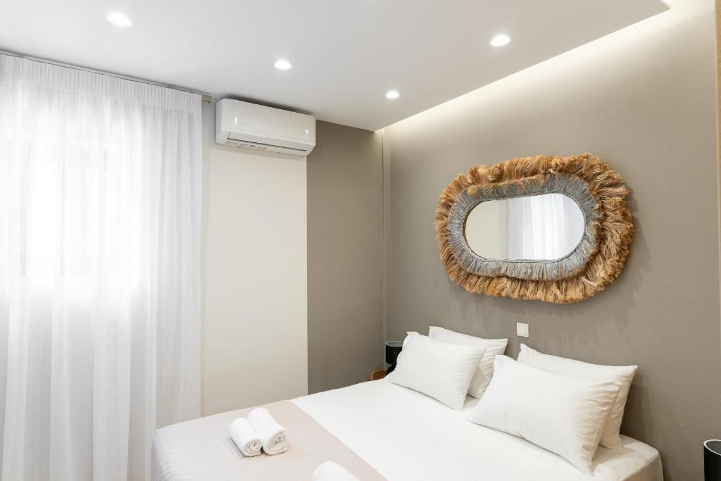 Letto o letti in una camera di Syra Suites