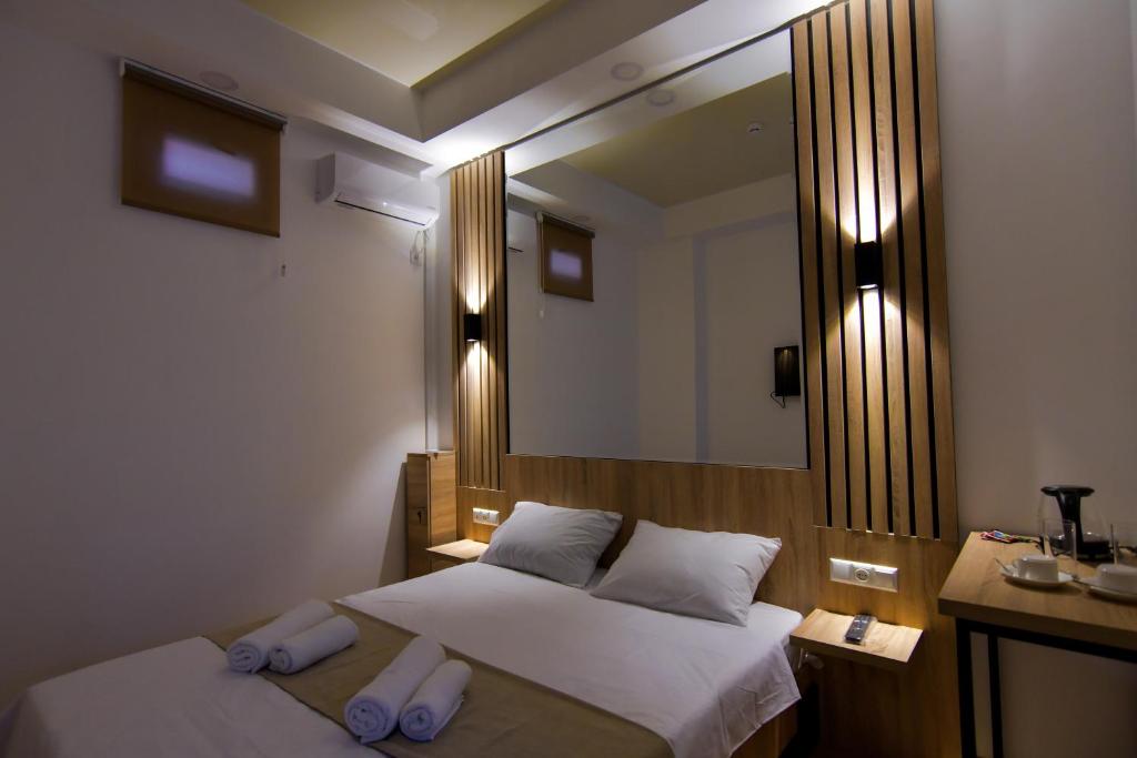 Postel nebo postele na pokoji v ubytování Euro Hotel Kutaisi