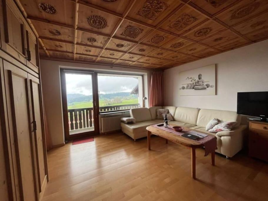 a living room with a couch and a table at Schnitzer-Stüble in Missen-Wilhams