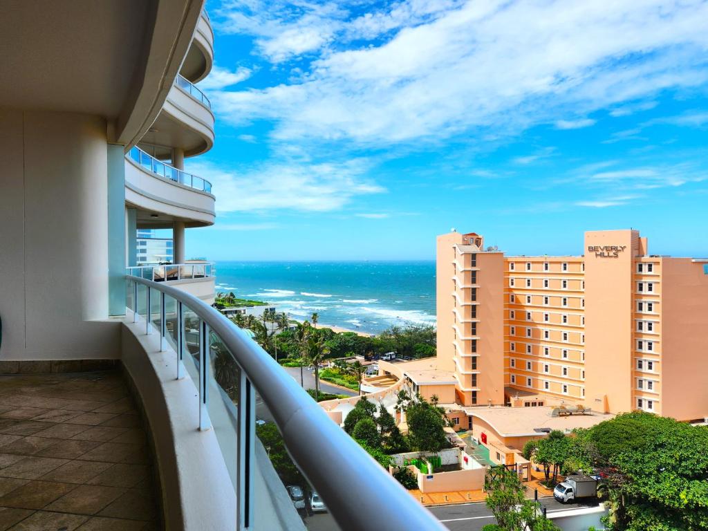 a balcony with a view of the ocean at 603 Oyster Rock Umhlanga Rocks in Durban