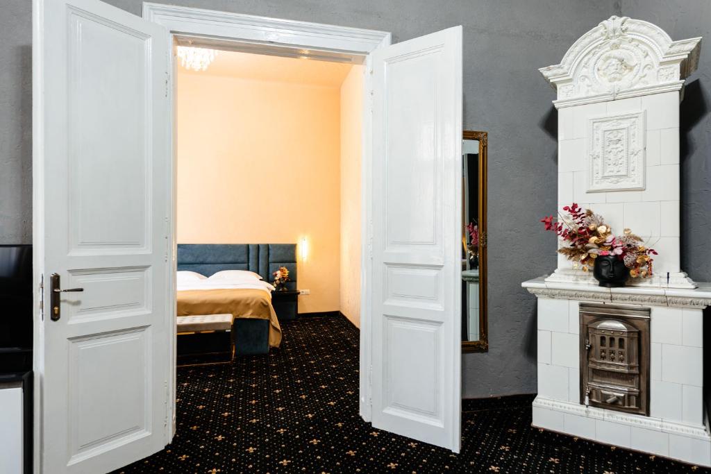 Postel nebo postele na pokoji v ubytování Palace Bulevard Inn
