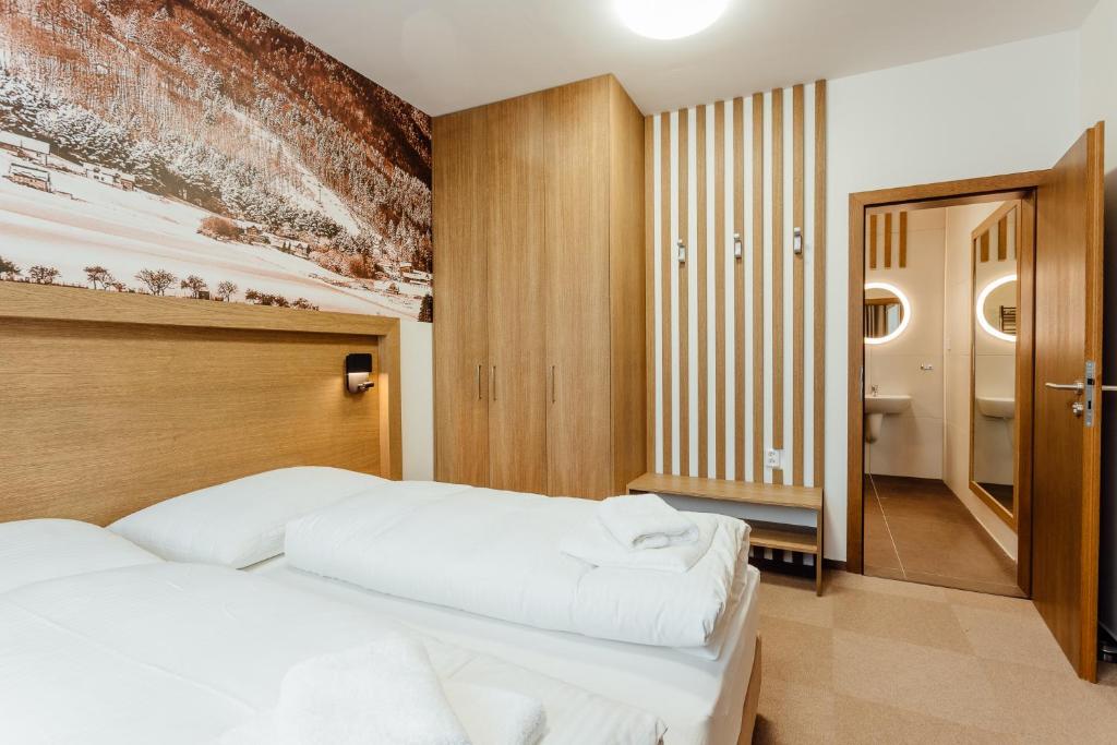 Postel nebo postele na pokoji v ubytování Apartmány Humno