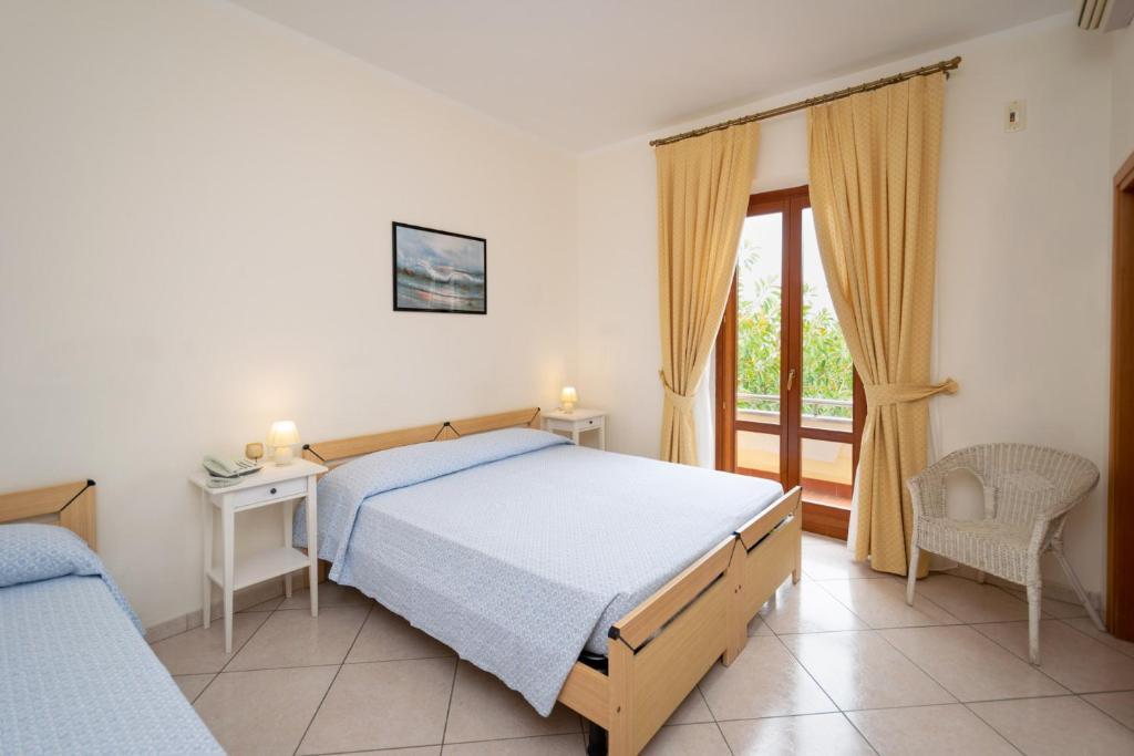 Кровать или кровати в номере Hotel Anna